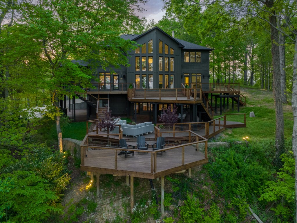 architectural drone photo from above a ravine to capture back of a home