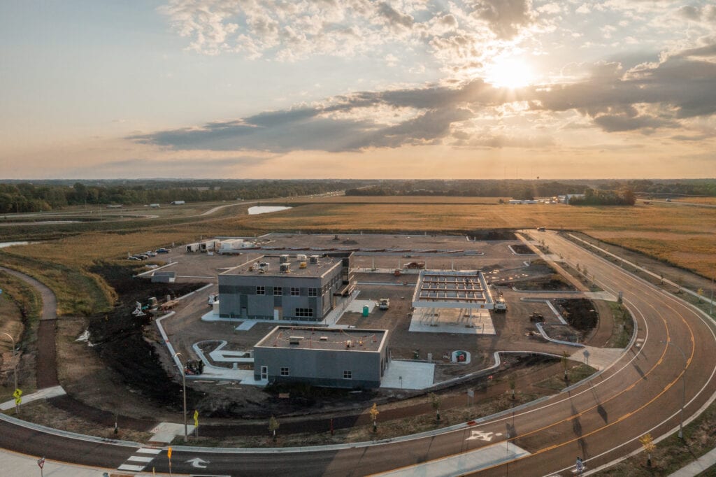 Aerial view of a construction site for a truck stop in the early morning hours.