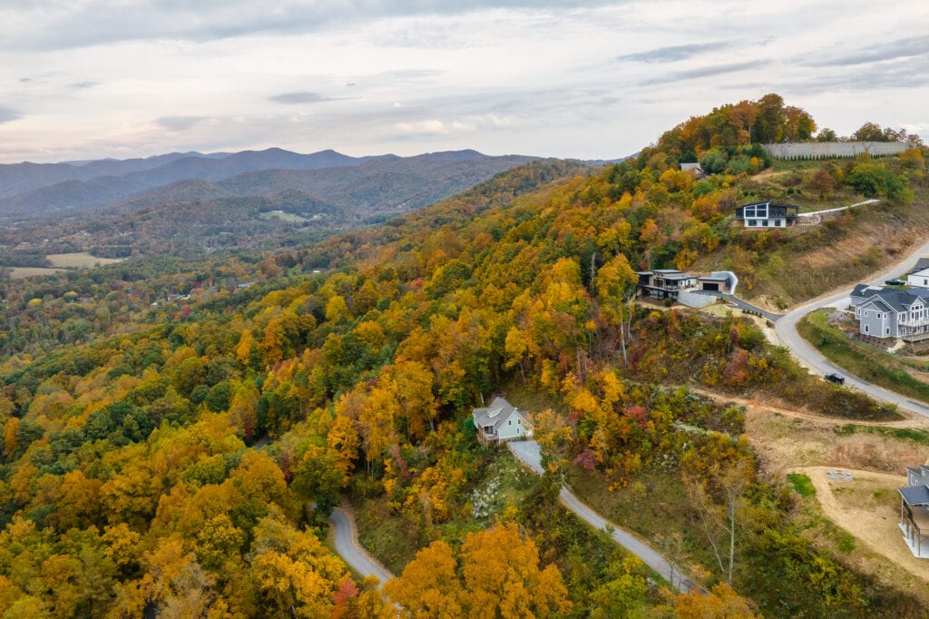 Aerial photo of a modern home in Asheville, NC with mountain views in the fall