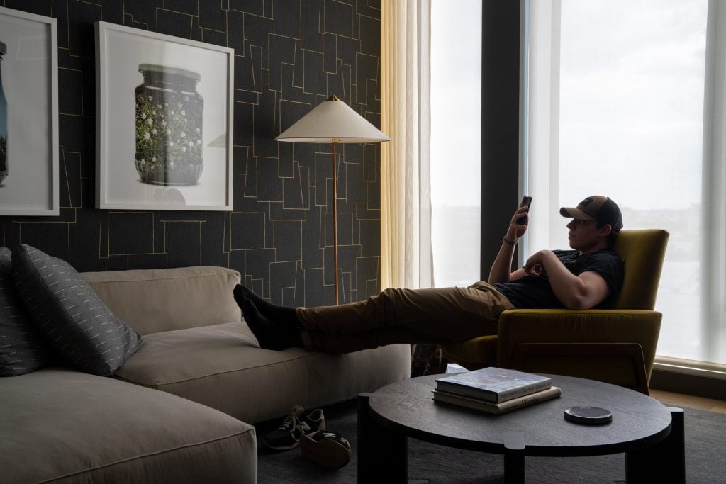 Architectural Photography Workshop in New York City 8 Interior photography of a man lounging in his New York City den