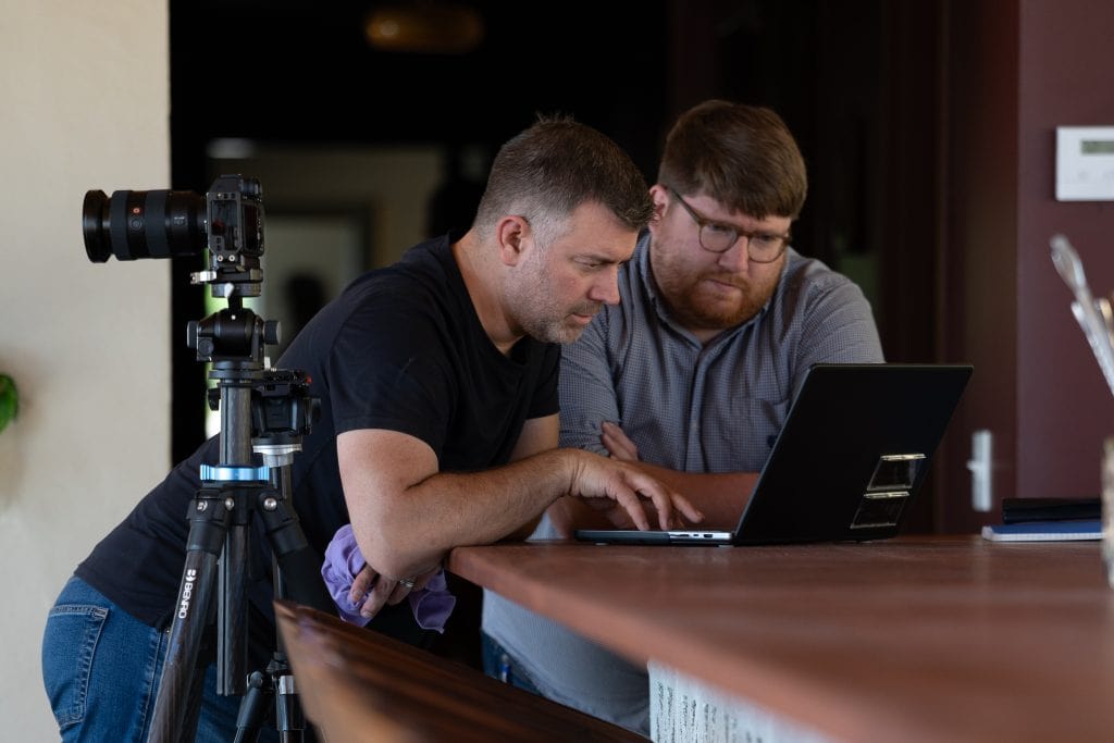 American architectural photographer Jordan Powers reviews images with CDP Architecture during a recent photo shoot