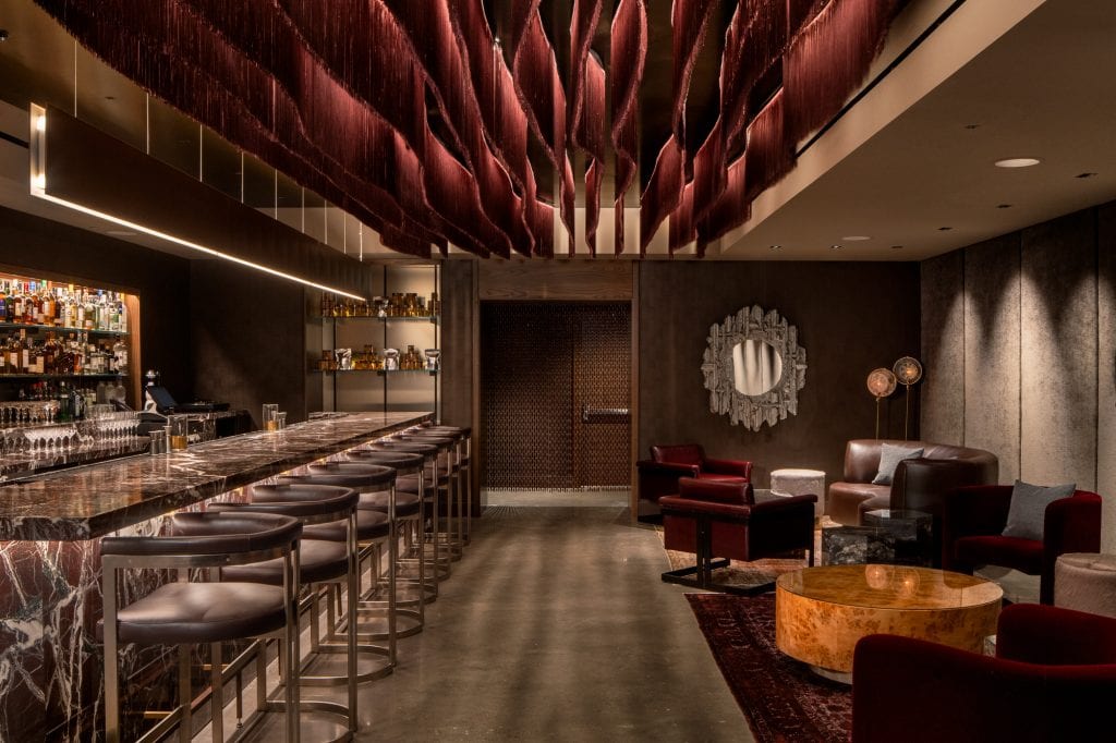 Beautifully designed hotel lounge with dark and moody vibe in downtown Nashville