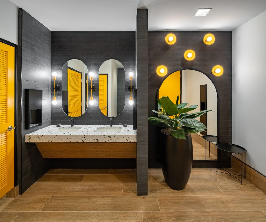 Commercial Interior Design Photography 5 Corporate office photography featuring well-designed restrooms with yellow paint, and creative lighting fixtueres