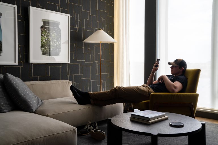 Man lounging in modern reading room